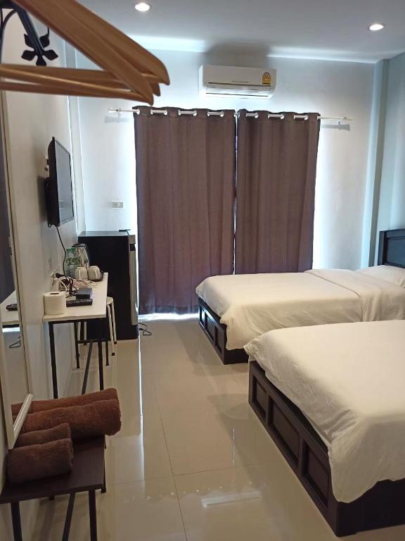 Postel nebo postele na pokoji v ubytování Kangsadan Resort
