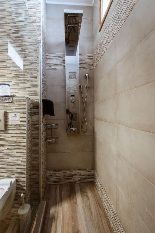 Koupelna v ubytování Deluxe Suites