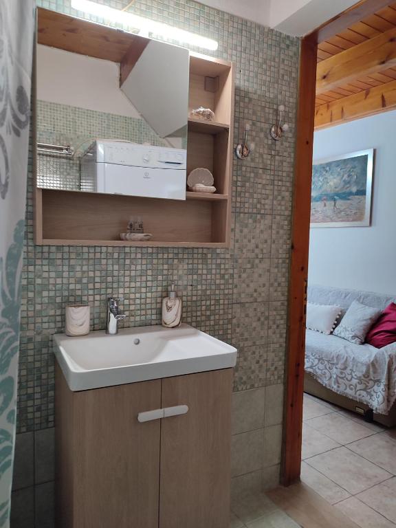 Postel nebo postele na pokoji v ubytování Marilou's Cottage