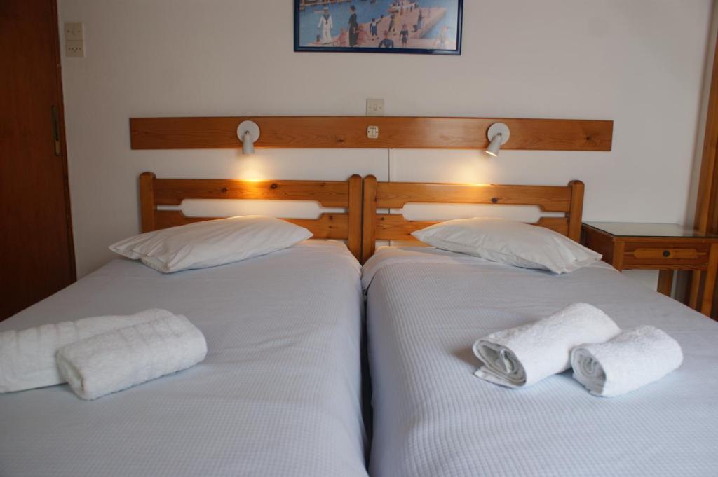 Postel nebo postele na pokoji v ubytování Hotel Eleftheria