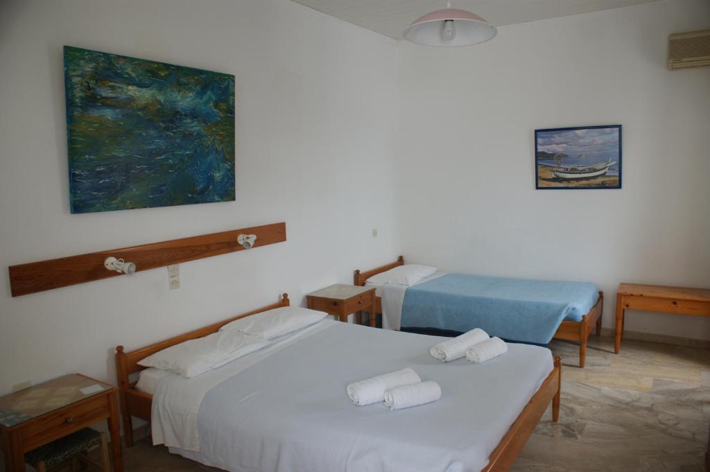 Postel nebo postele na pokoji v ubytování Hotel Eleftheria