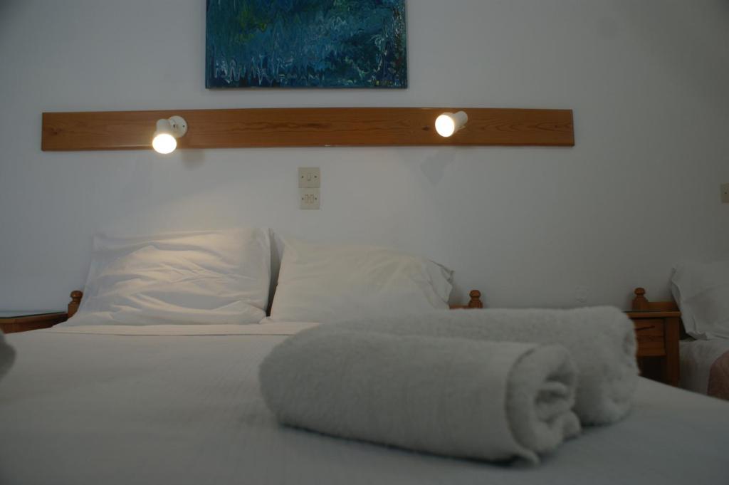 Postel nebo postele na pokoji v ubytování Hotel Eleftheria