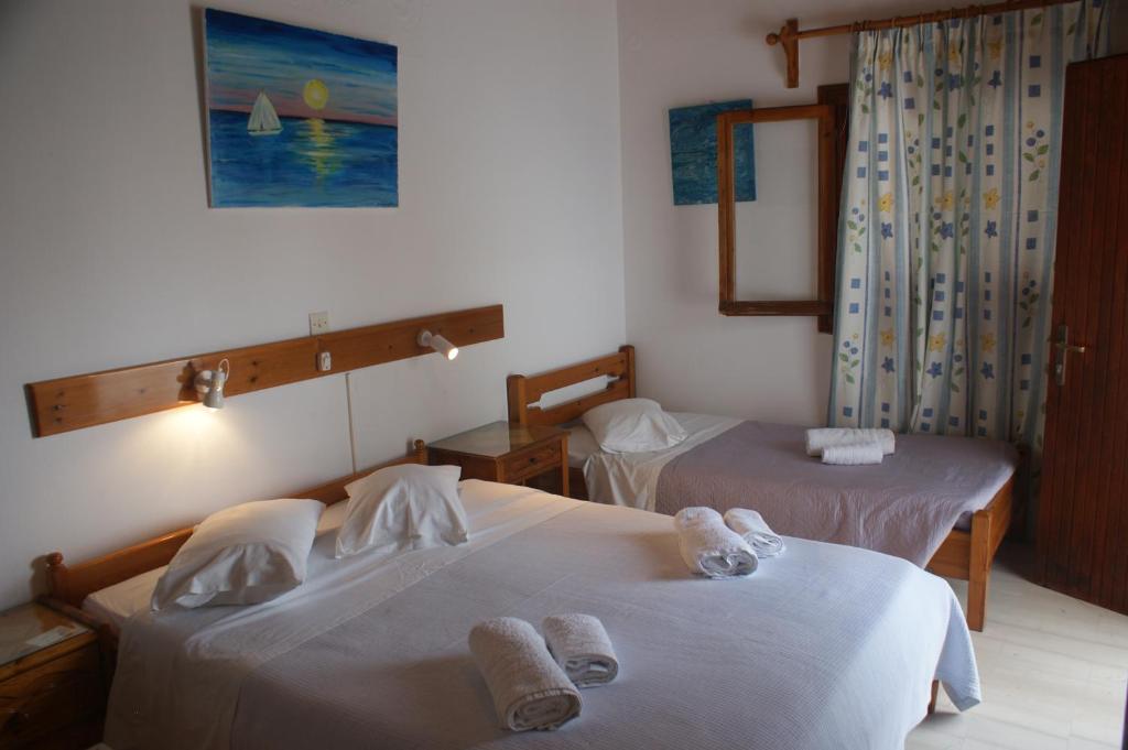 Postel nebo postele na pokoji v ubytování Hotel Eleftheria