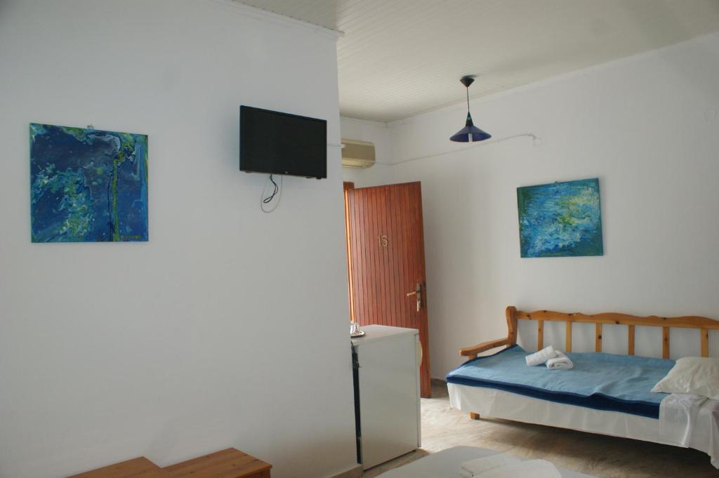 Postel nebo postele na pokoji v ubytování Hotel Eleftheria