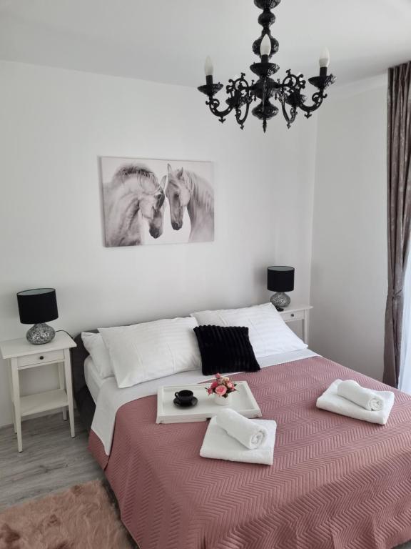 Posteľ alebo postele v izbe v ubytovaní BabyLu apartman