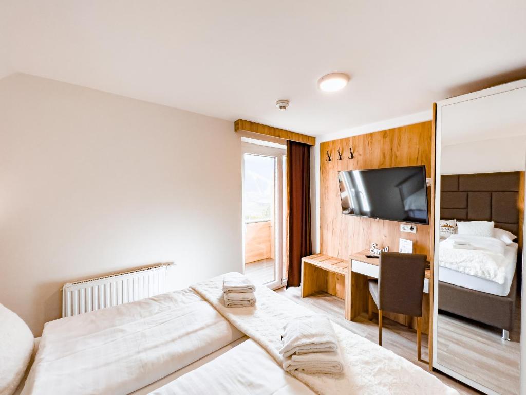 Postel nebo postele na pokoji v ubytování Sylpaulerhof Aparthotel
