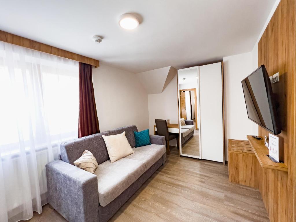 TV a/nebo společenská místnost v ubytování Sylpaulerhof Aparthotel