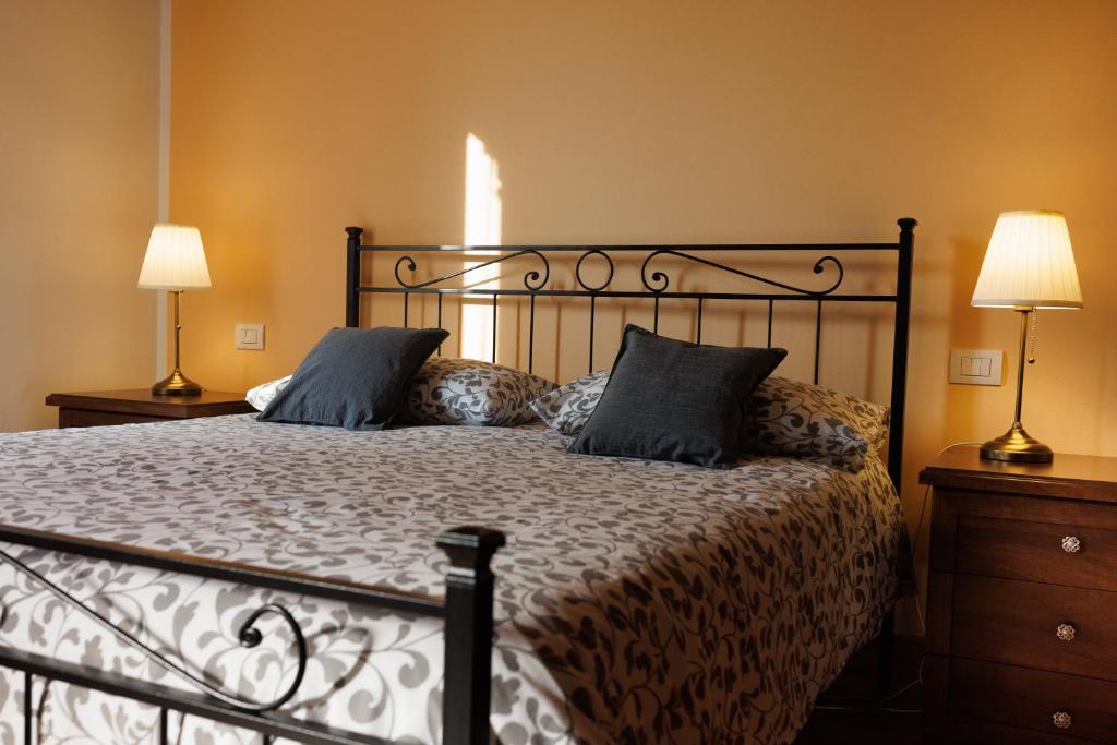 Postel nebo postele na pokoji v ubytování Manfredi B&B