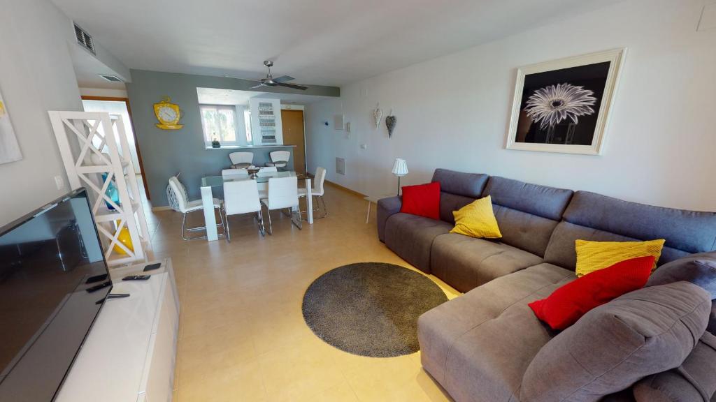a living room with a couch and a dining room at Espliego 3I5778-A Murcia Holiday Rentals Property in Torre-Pacheco
