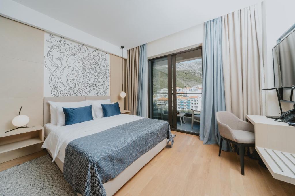 Postel nebo postele na pokoji v ubytování Katamare Hotel
