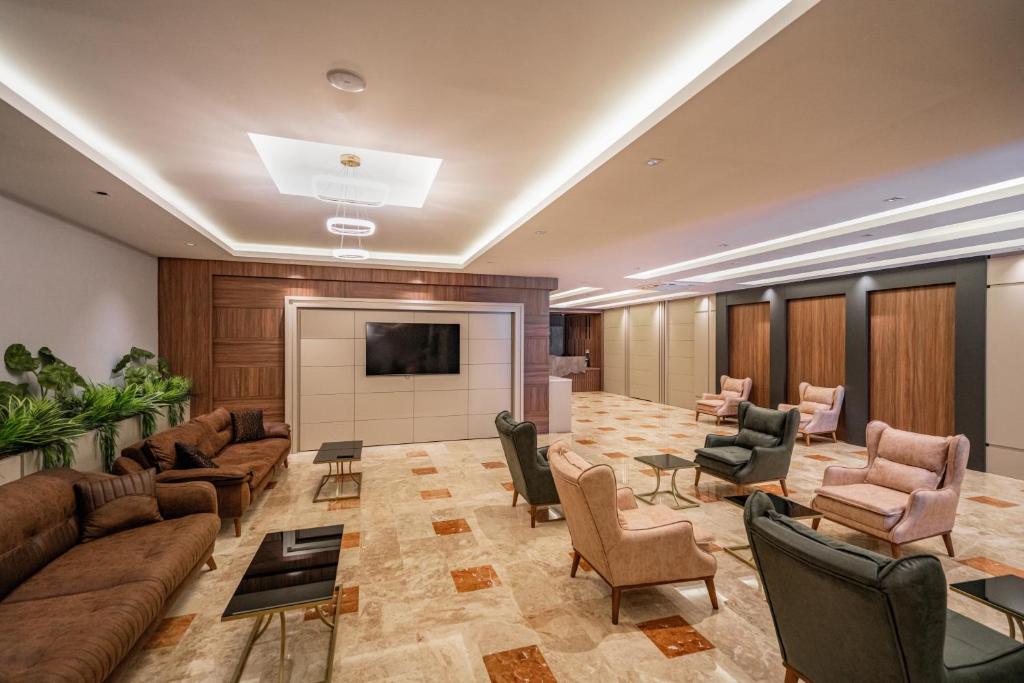 TV a/nebo společenská místnost v ubytování New Safir Apart Hotel