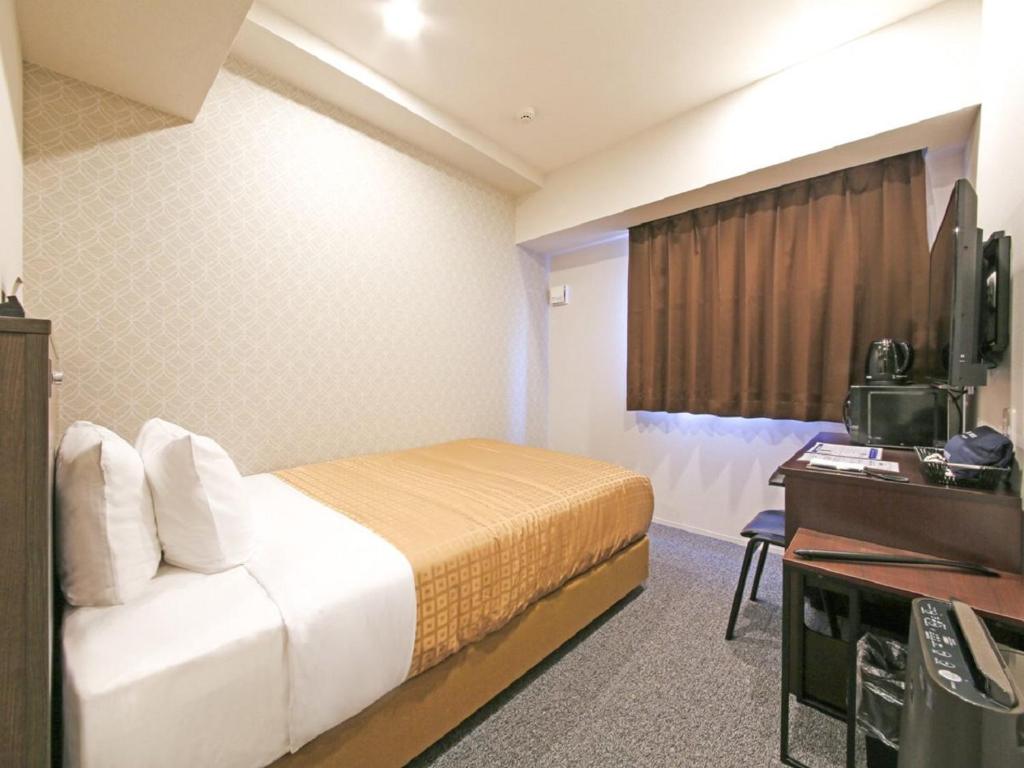 TV a/nebo společenská místnost v ubytování HOTEL LiVEMAX Chiba Chuo-Ekimae