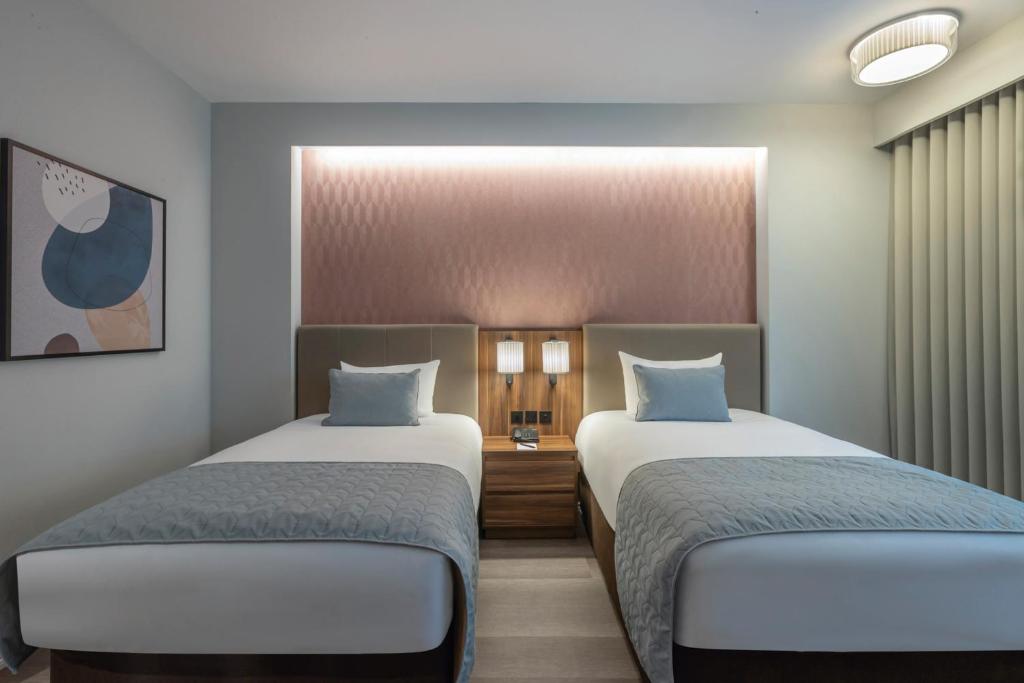 Voodi või voodid majutusasutuse Riu Plaza The Gresham Dublin toas