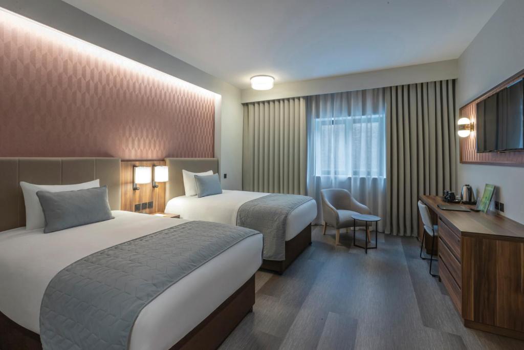 Voodi või voodid majutusasutuse Riu Plaza The Gresham Dublin toas