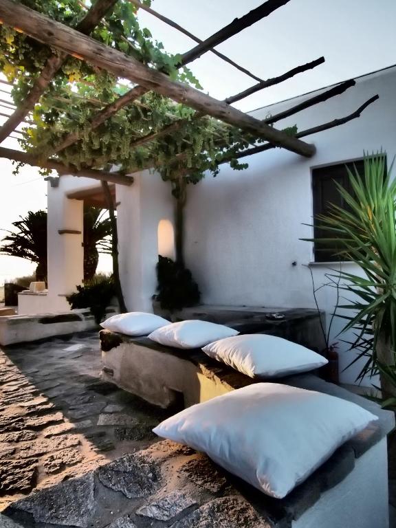 a group of pillows sitting on a patio at Sunset Pounda in Pounda