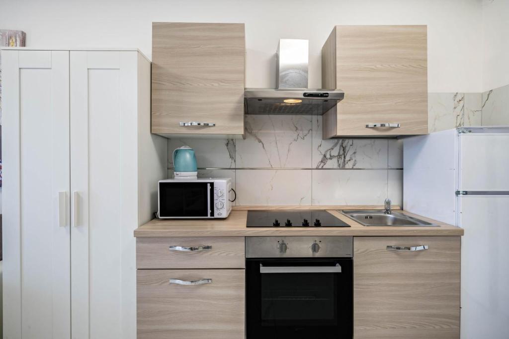 Kuchnia lub aneks kuchenny w obiekcie Planet Suite 303