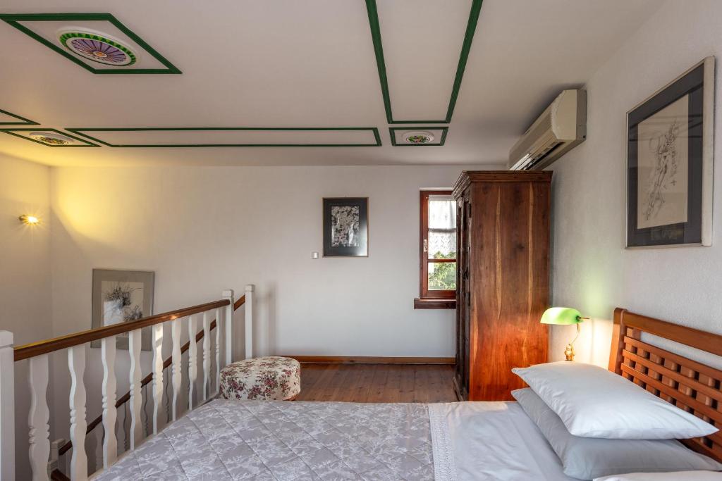 Postel nebo postele na pokoji v ubytování Gardenia Studios