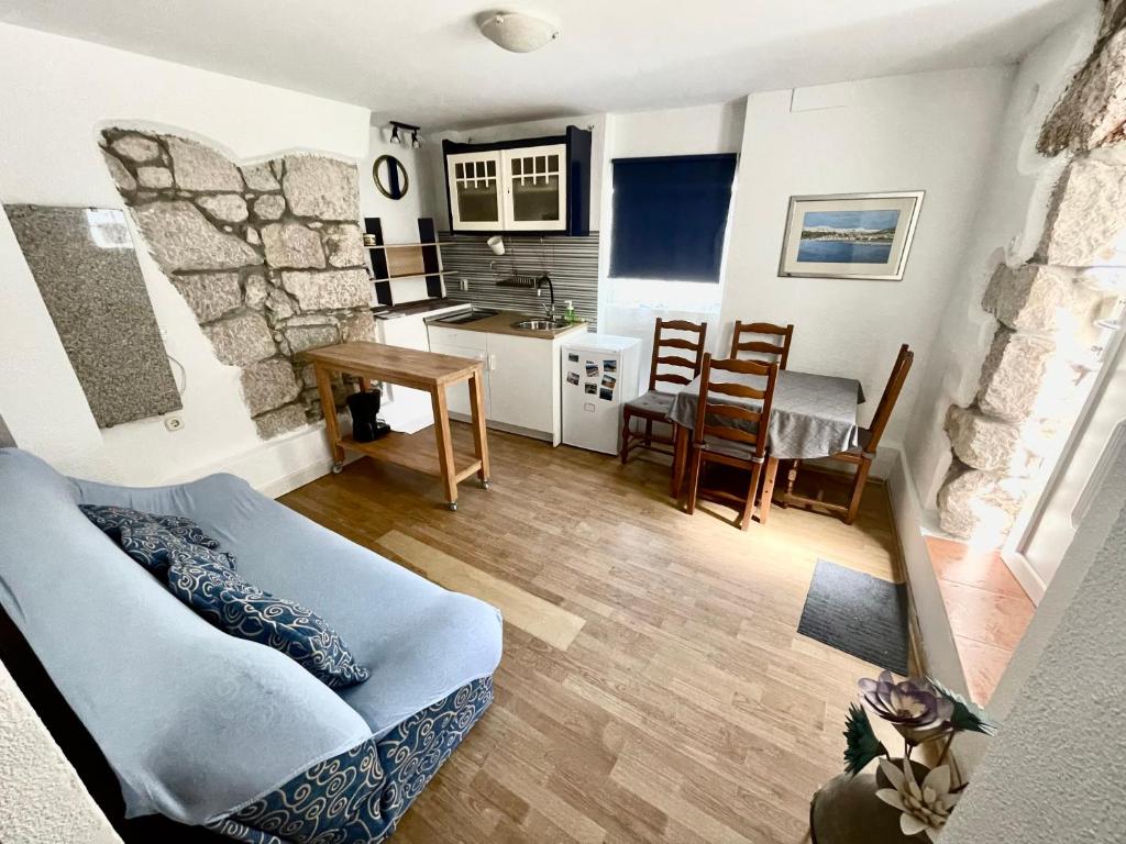 a living room with a couch and a table at Apartments Rome in Baška