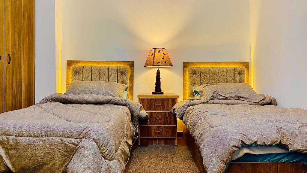 A bed or beds in a room at Jerash Canopy