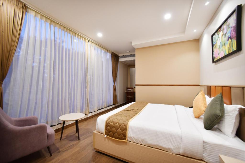Postel nebo postele na pokoji v ubytování Soho Boutique Hotel