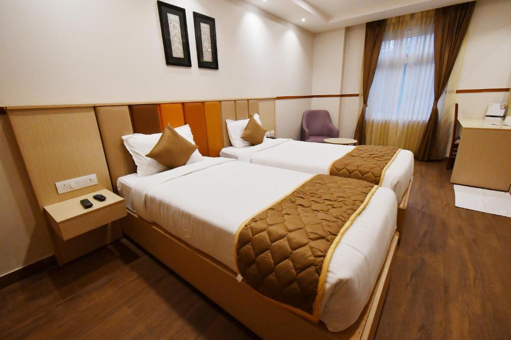 Postel nebo postele na pokoji v ubytování Soho Boutique Hotel