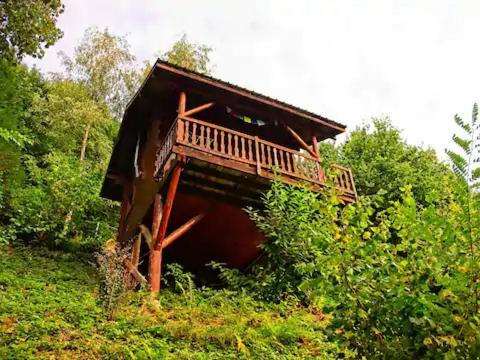 a wooden cabin in the middle of a forest at Domaine d'Avallon - petit Tibet au coeur des Alpes in Arvillard