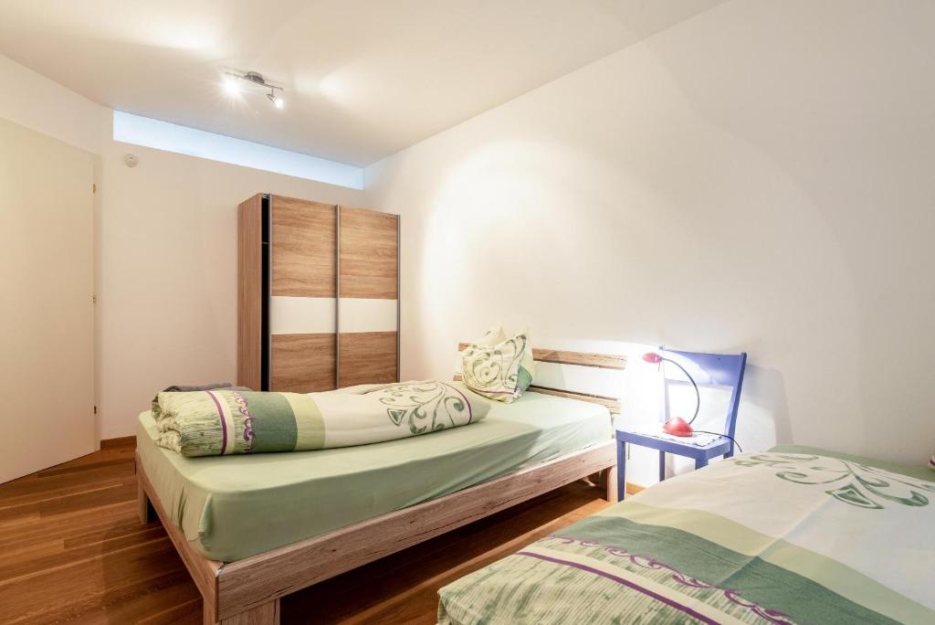 Posteľ alebo postele v izbe v ubytovaní Apartement Santner