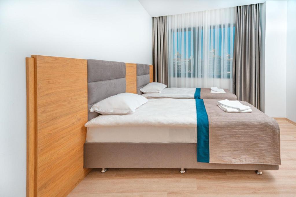 Postel nebo postele na pokoji v ubytování New Safir Apart Hotel