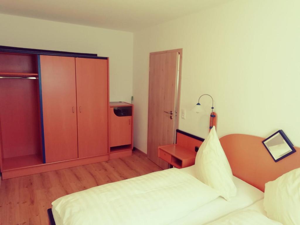 Postel nebo postele na pokoji v ubytování Büchelsteiner Hof