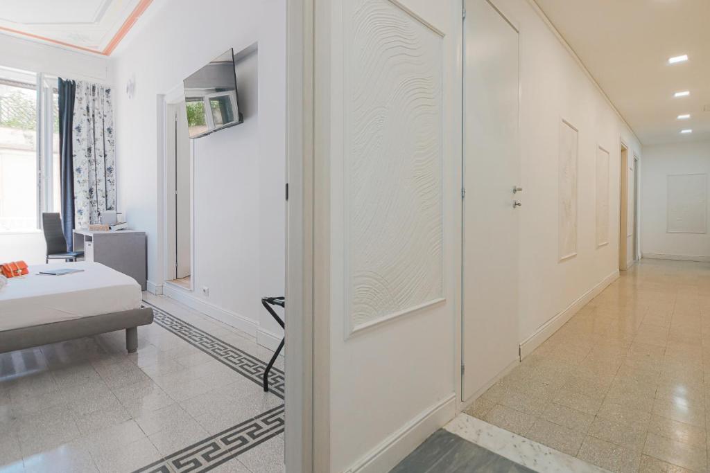 Postel nebo postele na pokoji v ubytování Erreggi Luxury Rooms