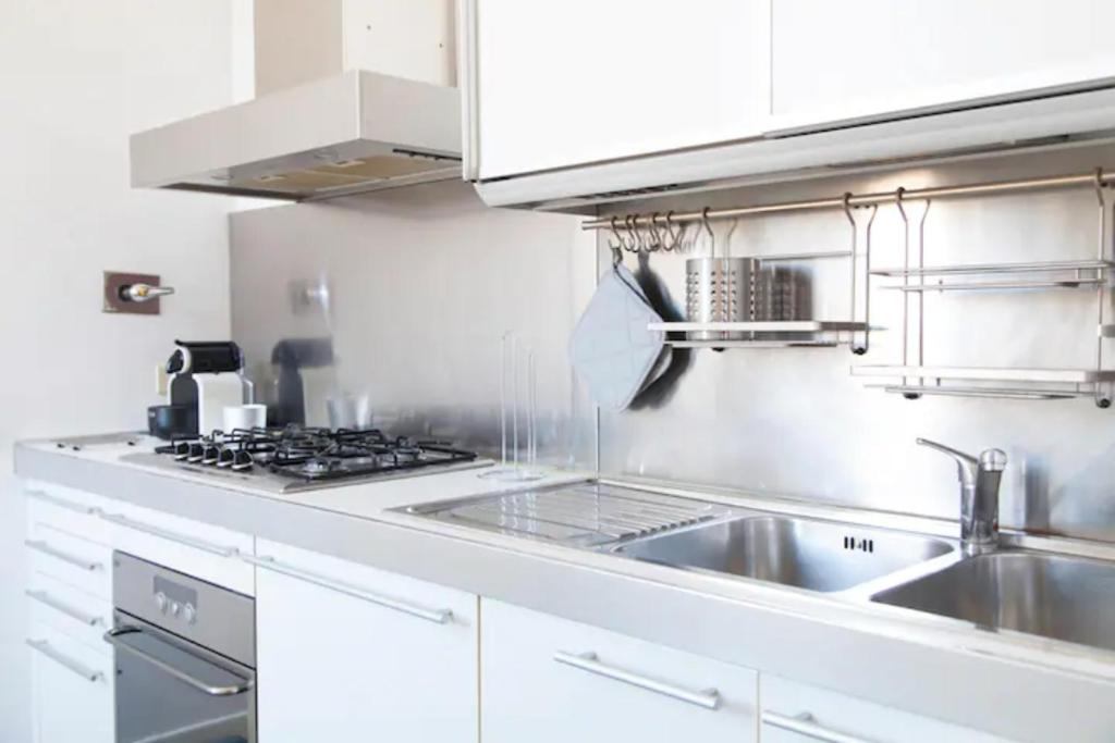 Kuchyňa alebo kuchynka v ubytovaní Navona Design Apartment Casa e Appartamento per Vacanze