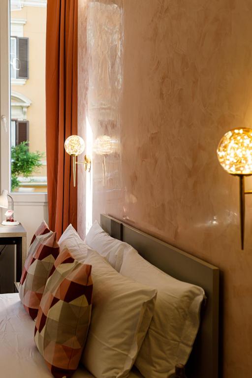 Postel nebo postele na pokoji v ubytování Erreggi Luxury Rooms