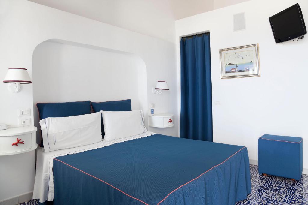 Postel nebo postele na pokoji v ubytování Hotel La Terrazza