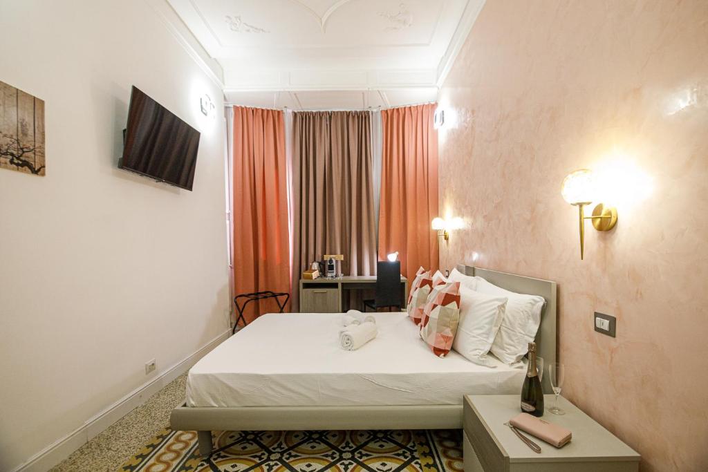 TV a/nebo společenská místnost v ubytování Erreggi Luxury Rooms
