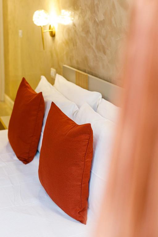 Postel nebo postele na pokoji v ubytování Erreggi Luxury Rooms