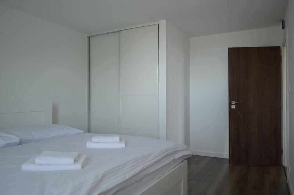 A bed or beds in a room at Ager Apartments