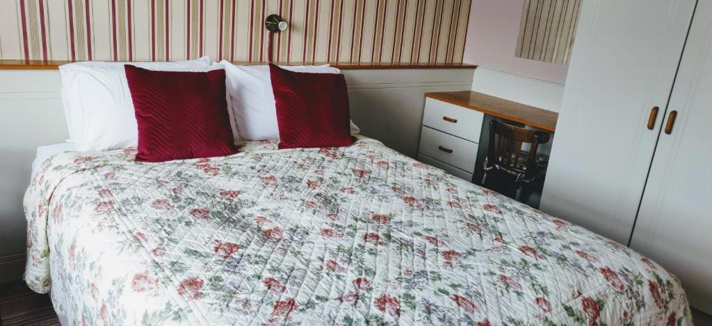 Postel nebo postele na pokoji v ubytování Teac Campbell Guesthouse