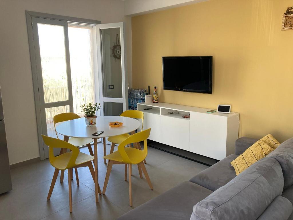 Televízia a/alebo spoločenská miestnosť v ubytovaní Sole a vista