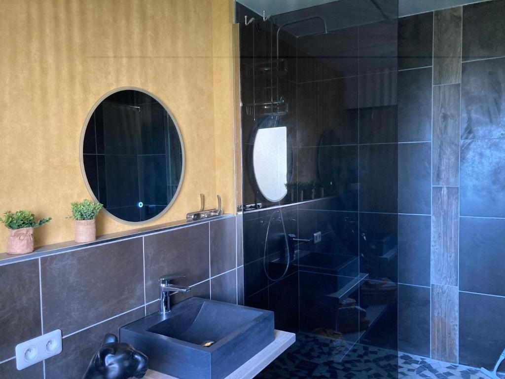 a bathroom with a sink and two mirrors at Nouveau !! Bel appartement à Fécamp tout près de la plage, gare et voie verte in Fécamp