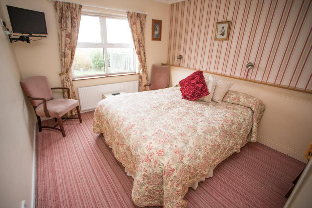 Postel nebo postele na pokoji v ubytování Teac Campbell Guesthouse