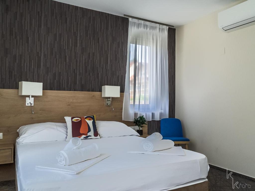 Postel nebo postele na pokoji v ubytování Easy Suites Hévíz