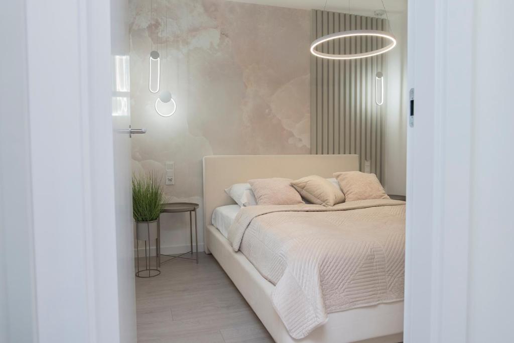 Posteľ alebo postele v izbe v ubytovaní Promenada Gwiazd 14 by Baltic Home
