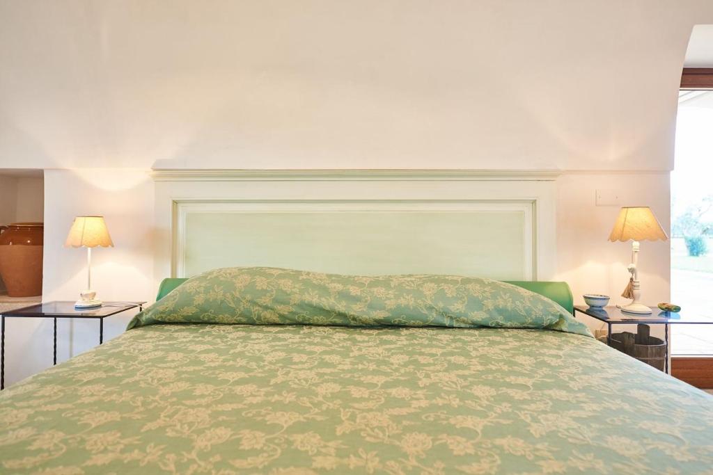 Łóżko lub łóżka w pokoju w obiekcie Villa Pompea al piano terra - Apulia Home