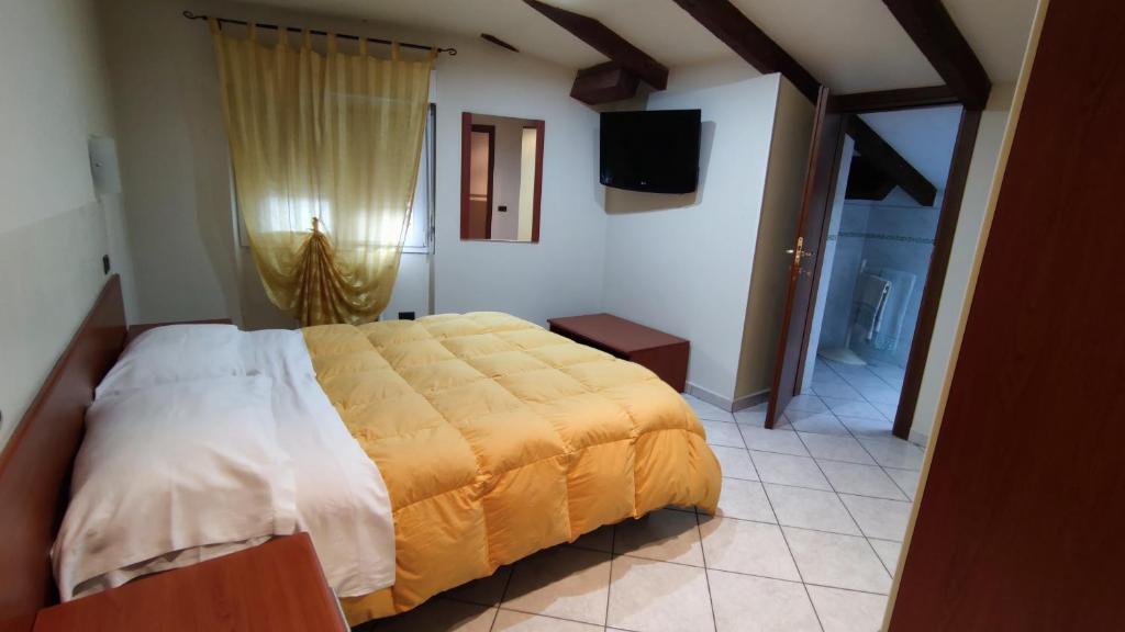 Postel nebo postele na pokoji v ubytování Hotel Emiliana