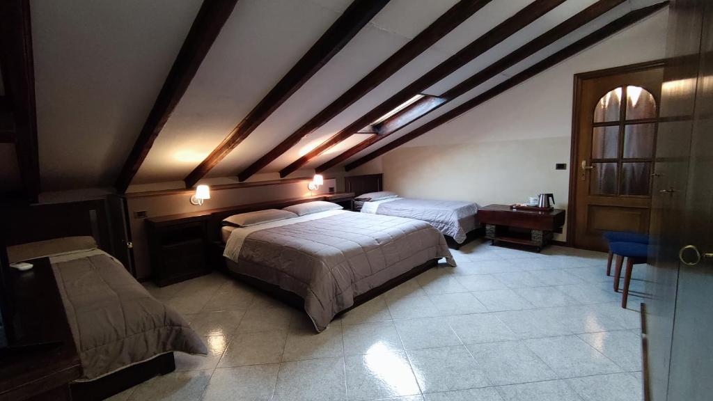 Postel nebo postele na pokoji v ubytování Hotel Emiliana