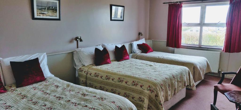 Postel nebo postele na pokoji v ubytování Teac Campbell Guesthouse