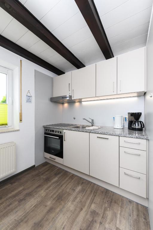 Kuchyň nebo kuchyňský kout v ubytování Haus Nordseepferdchen