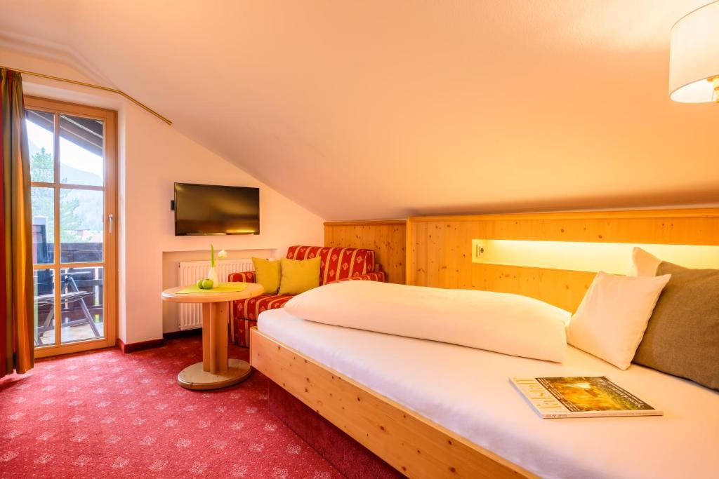 Postel nebo postele na pokoji v ubytování Aparthotel Weinklause Superior
