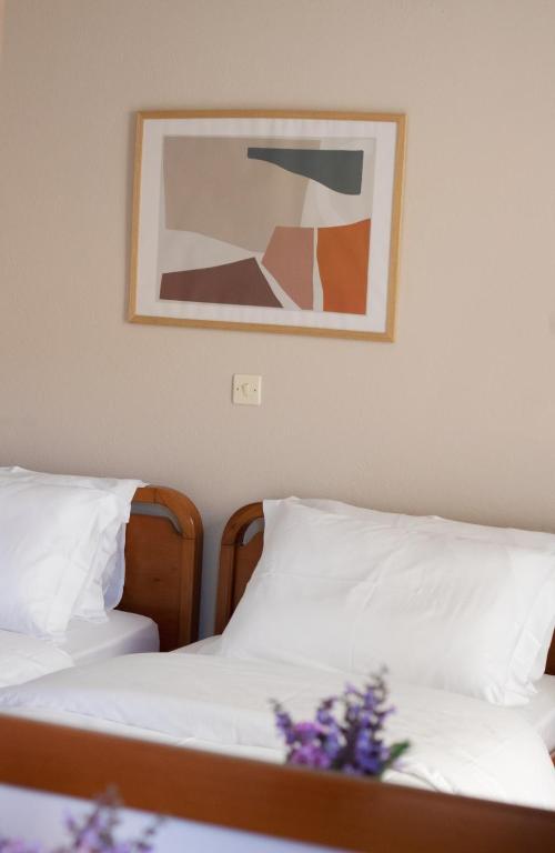 Postel nebo postele na pokoji v ubytování Pomelo Rooms