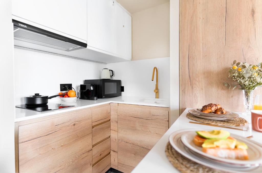 A kitchen or kitchenette at Jávea Boutique Suites - Holiday Apartments